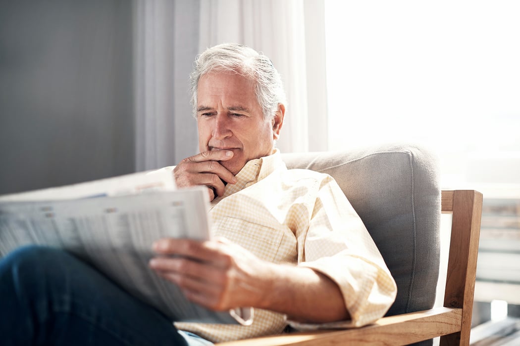 senior-man-thinking-reading